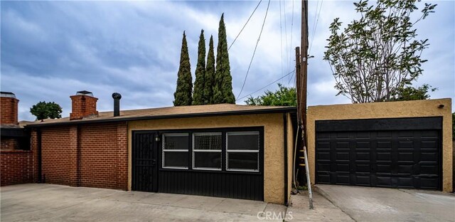 garage with concrete driveway