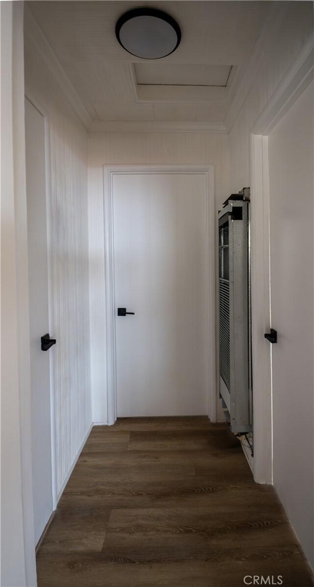 hall with attic access and dark wood finished floors