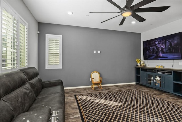 living area with dark wood-style floors, ceiling fan, recessed lighting, and baseboards