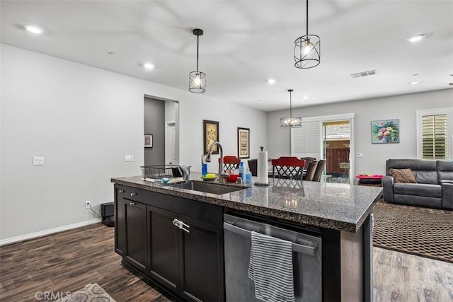 kitchen featuring a sink, stainless steel dishwasher, dark wood-style flooring, open floor plan, and recessed lighting