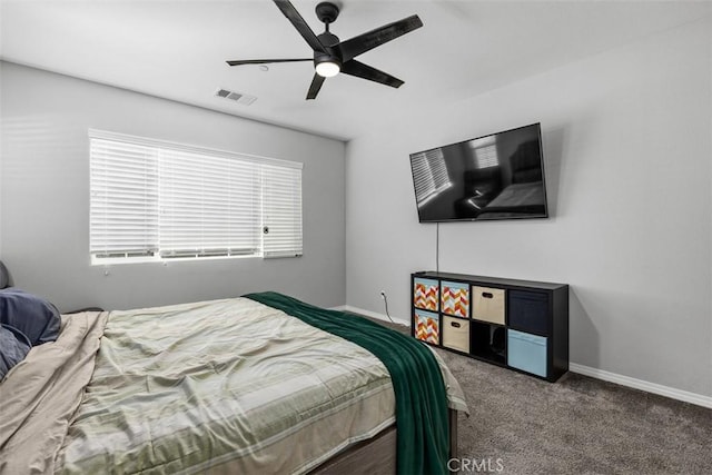 bedroom featuring carpet flooring, baseboards, and a ceiling fan