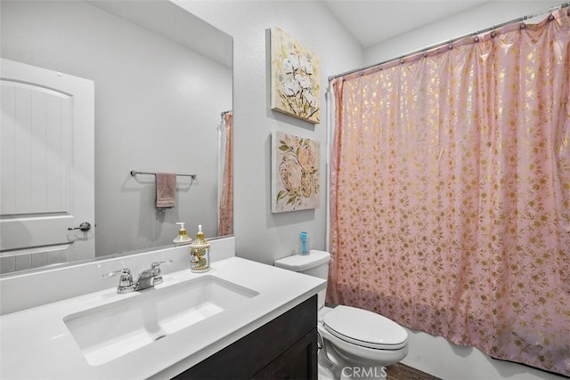 bathroom featuring toilet, vanity, and shower / tub combo with curtain