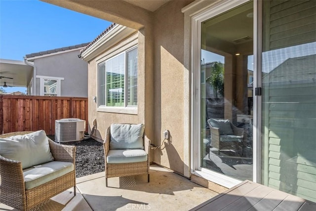 view of patio / terrace featuring fence and cooling unit