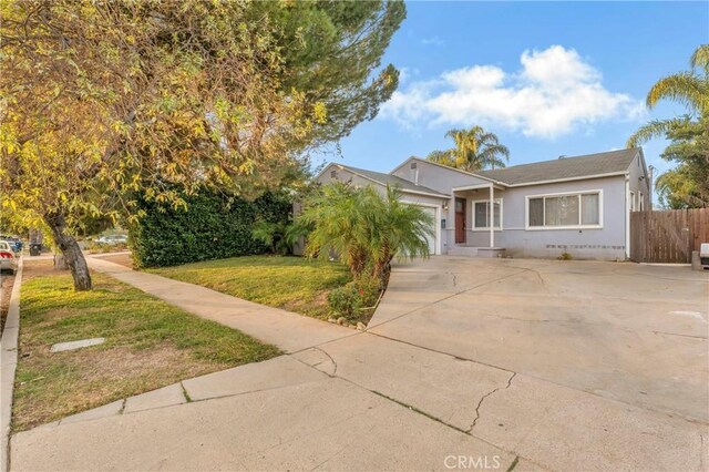 19119 Lemay St, Reseda, CA 91335 - view of front of home with a garage, concrete driveway, and stucco siding