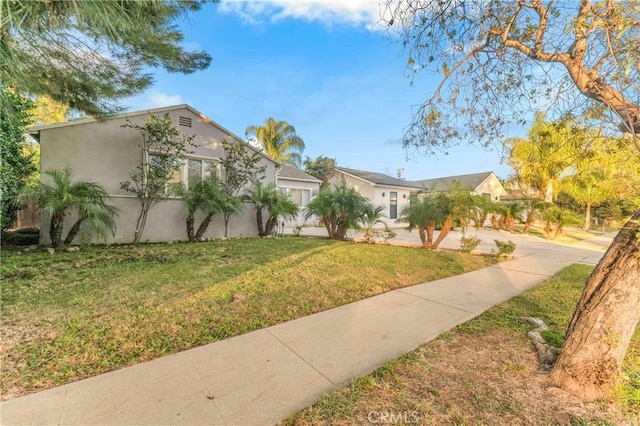 19119 Lemay St, Reseda, CA 91335 - view of front of home with stucco siding and a front lawn