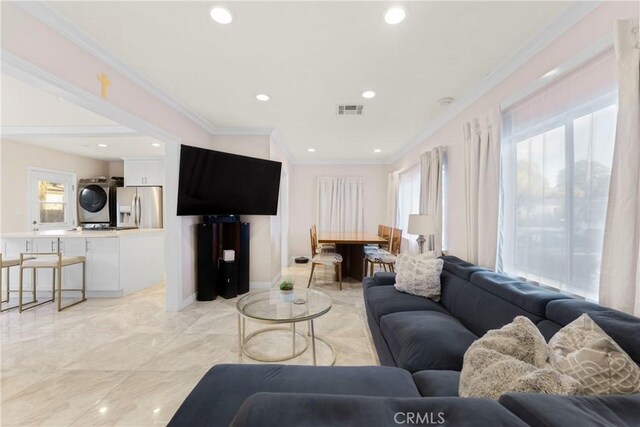 19119 Lemay St, Reseda, CA 91335 - living room with stacked washer and clothes dryer, ornamental molding, light marble finish flooring, and recessed lighting