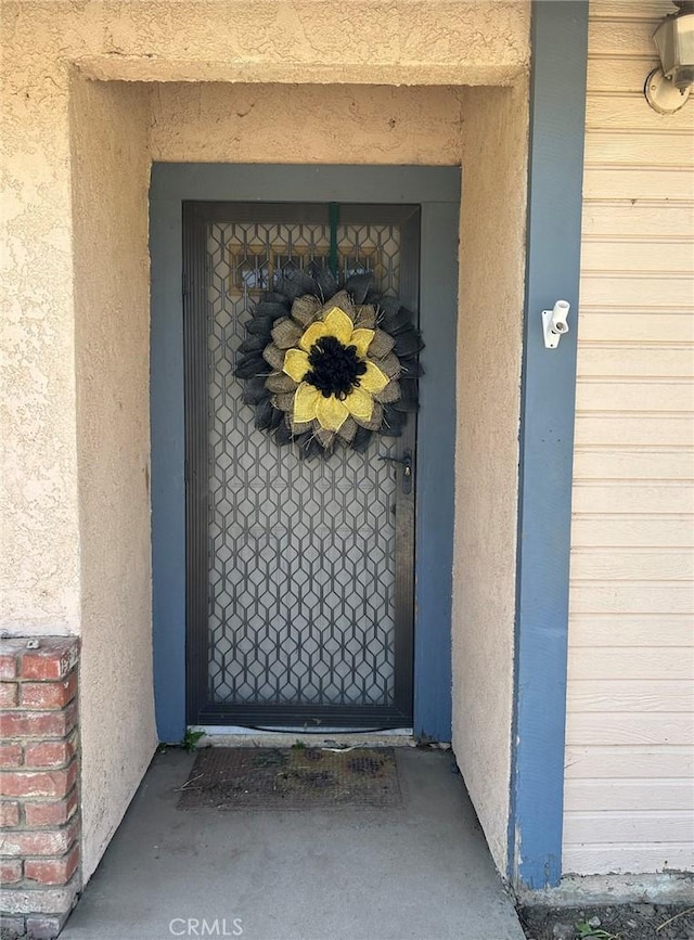 14402 Boxtree St, Lake Hughes, CA 93532 - view of exterior entry featuring stucco siding