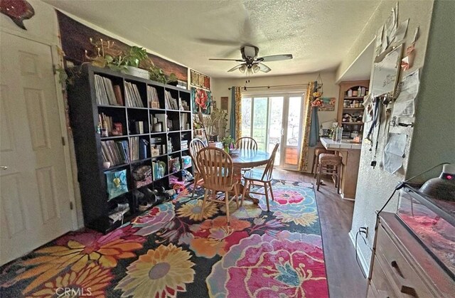 14402 Boxtree St, Lake Hughes, CA 93532 - dining area with ceiling fan, a textured ceiling, and wood finished floors