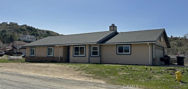 14402 Boxtree St, Lake Hughes, CA 93532 - ranch-style house with a chimney and an attached garage