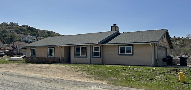 14402 Boxtree St, Lake Hughes, CA 93532 - view of front of property featuring a chimney and an attached garage