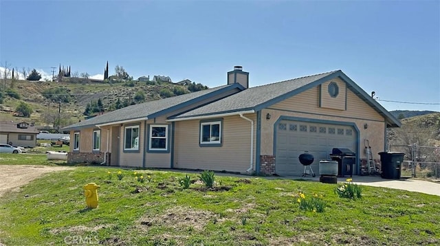 14402 Boxtree St, Lake Hughes, CA 93532 - view of side of property featuring a garage, concrete driveway, a chimney, and brick siding