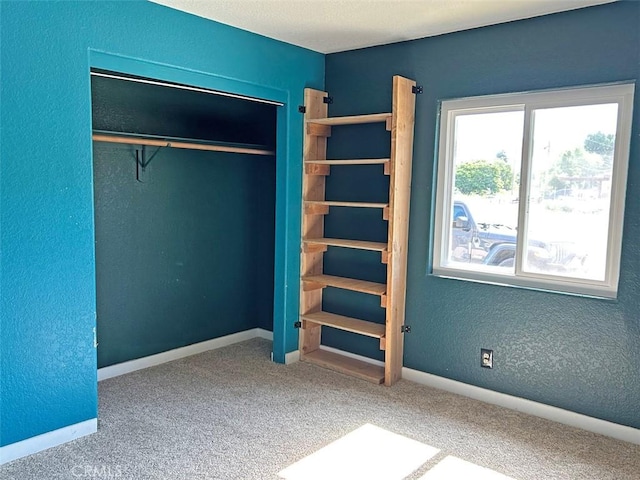 14402 Boxtree St, Lake Hughes, CA 93532 - unfurnished bedroom featuring carpet and a closet