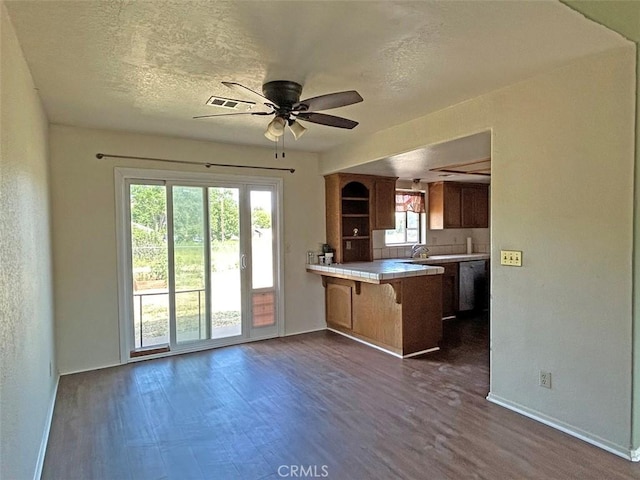 14402 Boxtree St, Lake Hughes, CA 93532 - kitchen featuring a peninsula, a ceiling fan, dark wood-style flooring, open shelves, and open floor plan