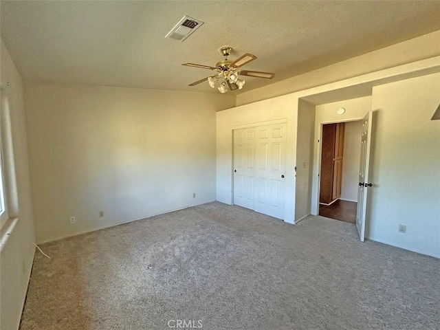 14402 Boxtree St, Lake Hughes, CA 93532 - unfurnished bedroom with carpet floors, ceiling fan, and a closet