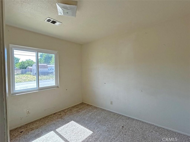 14402 Boxtree St, Lake Hughes, CA 93532 - empty room with carpet floors and a textured ceiling