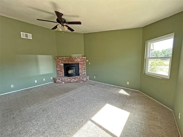 14402 Boxtree St, Lake Hughes, CA 93532 - unfurnished living room with a ceiling fan, carpet flooring, a textured ceiling, and a fireplace