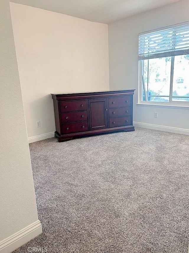 16045 Jackson Dr, Fontana, CA 92336 - unfurnished bedroom with light carpet and baseboards