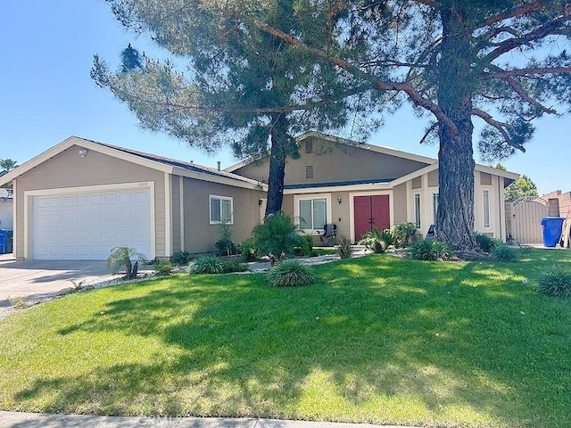 16045 Jackson Dr, Fontana, CA 92336 - ranch-style home with a garage, a front yard, concrete driveway, and stucco siding