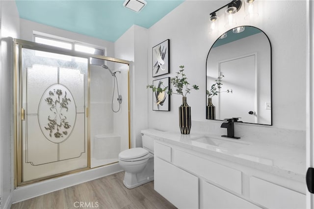 24071 Orange Creek Cir, Moreno Valley, CA 92557 - full bath featuring toilet, wood finished floors, a shower stall, and vanity