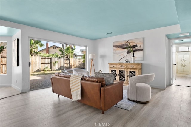 24071 Orange Creek Cir, Moreno Valley, CA 92557 - living room featuring wood finished floors and baseboards