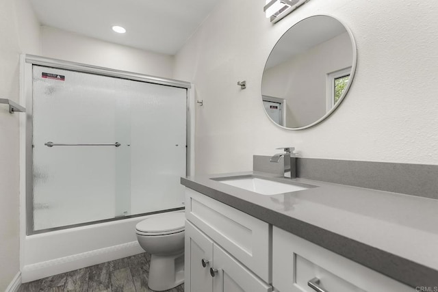 13500 Jamul Dr, Jamul, CA 91935 - full bathroom featuring toilet, wood finished floors, vanity, shower / bath combination with glass door, and recessed lighting
