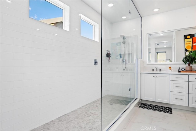 27120 Purple Sage Ct, Valencia, CA 91381 - full bathroom featuring a walk in shower, vanity, marble finish floors, and recessed lighting