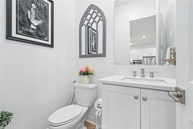 27120 Purple Sage Ct, Valencia, CA 91381 - half bath featuring toilet, vanity, and baseboards