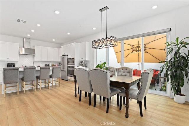 27120 Purple Sage Ct, Valencia, CA 91381 - dining room with light wood-type flooring, recessed lighting, and a chandelier