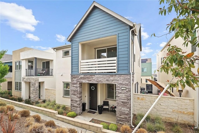 27120 Purple Sage Ct, Valencia, CA 91381 - view of property featuring a balcony and stone siding