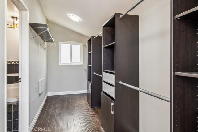 2819 Steeplechase Ln, Diamond Bar, CA 91765 - walk in closet with vaulted ceiling and dark wood-style floors