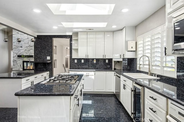 2819 Steeplechase Ln, Diamond Bar, CA 91765 - kitchen featuring a sink, wine cooler, stainless steel appliances, white cabinetry, and backsplash