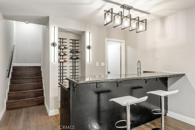2819 Steeplechase Ln, Diamond Bar, CA 91765 - bar area with wood finished floors, stairway, and hanging light fixtures
