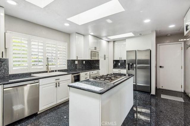 2819 Steeplechase Ln, Diamond Bar, CA 91765 - kitchen featuring appliances with stainless steel finishes, a sink, granite floors, a skylight, and recessed lighting