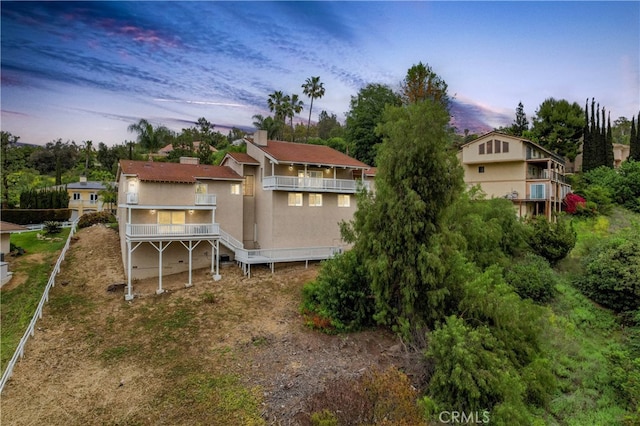 2819 Steeplechase Ln, Diamond Bar, CA 91765 - rear view of property featuring stucco siding, view of scattered trees, and a balcony