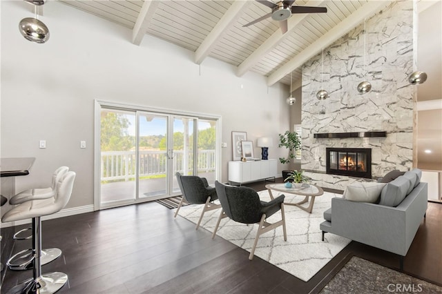2819 Steeplechase Ln, Diamond Bar, CA 91765 - living room featuring high vaulted ceiling, wood finished floors, a wood ceiling with exposed beams, a ceiling fan, and a stone fireplace