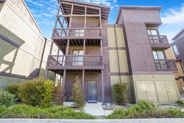 rear view of house with a balcony