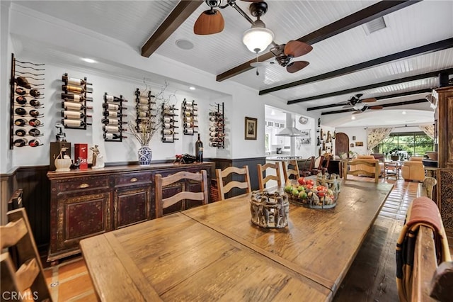 22658 Arriba Dr, Saugus, CA 91350 - dining area featuring ceiling fan, beam ceiling, and a wainscoted wall