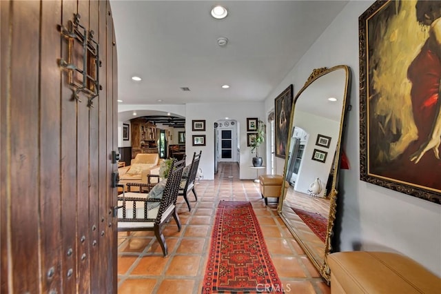 22658 Arriba Dr, Saugus, CA 91350 - hallway featuring arched walkways, recessed lighting, and light tile patterned floors
