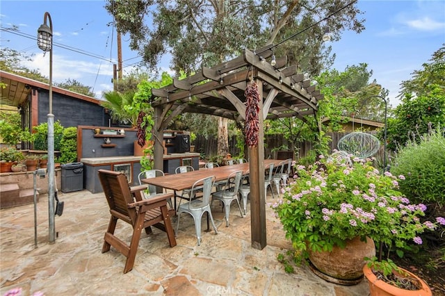 22658 Arriba Dr, Saugus, CA 91350 - view of patio / terrace with outdoor dining area, a pergola, and fence