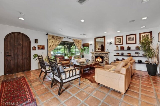 22658 Arriba Dr, Saugus, CA 91350 - living area featuring a stone fireplace, recessed lighting, and arched walkways