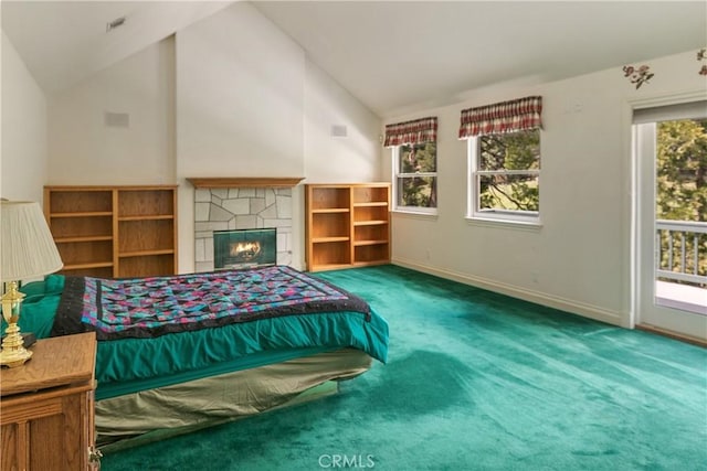 109 S Fairway Dr, Lake Arrowhead, CA 92352 - carpeted bedroom featuring lofted ceiling, multiple windows, access to outside, baseboards, and a stone fireplace