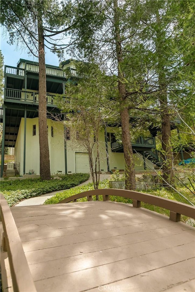 109 S Fairway Dr, Lake Arrowhead, CA 92352 - wooden deck featuring stairs and an attached garage