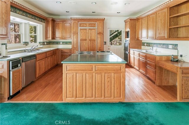 109 S Fairway Dr, Lake Arrowhead, CA 92352 - kitchen with appliances with stainless steel finishes, a sink, a kitchen island, light wood-style floors, and recessed lighting