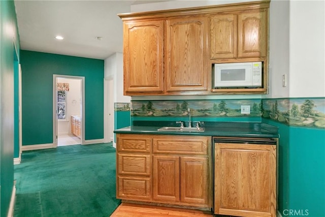 109 S Fairway Dr, Lake Arrowhead, CA 92352 - kitchen featuring a sink, white microwave, dark countertops, dishwashing machine, and baseboards