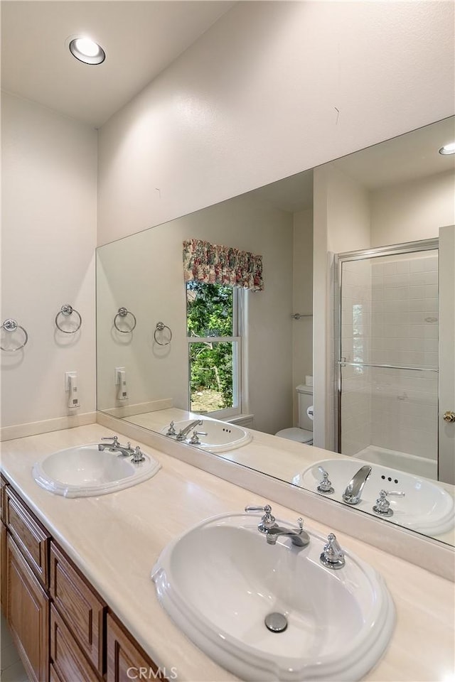109 S Fairway Dr, Lake Arrowhead, CA 92352 - full bathroom featuring toilet, a shower stall, double vanity, and recessed lighting