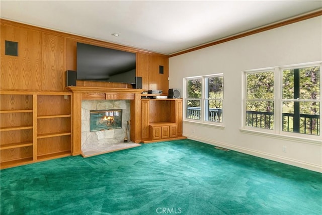 109 S Fairway Dr, Lake Arrowhead, CA 92352 - unfurnished living room with baseboards, a tiled fireplace, ornamental molding, and carpet flooring