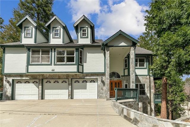 109 S Fairway Dr, Lake Arrowhead, CA 92352 - view of front of home featuring stone siding, a garage, and concrete driveway