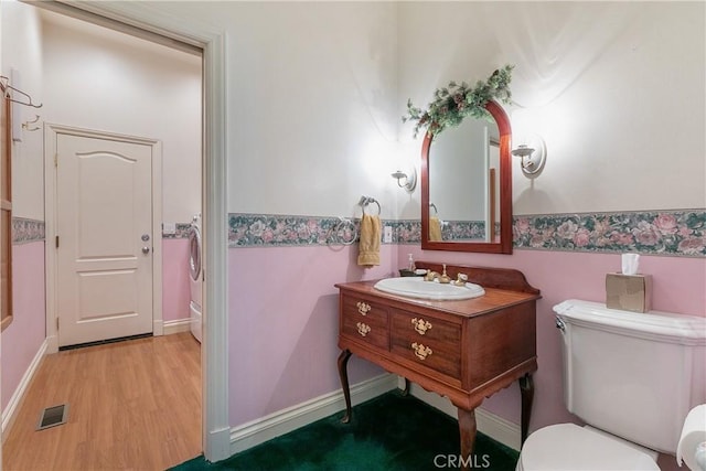 109 S Fairway Dr, Lake Arrowhead, CA 92352 - bathroom featuring toilet, wood finished floors, and vanity