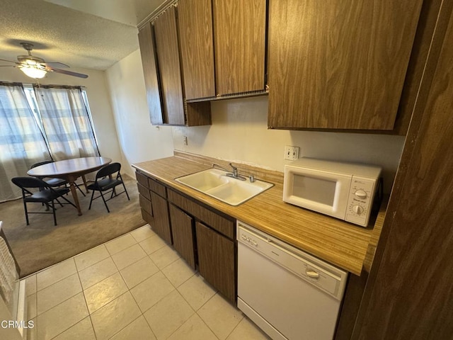 8800 Cedros Ave Unit 210, Panorama City, CA 91402 - kitchen featuring white appliances, a sink, light carpet, a textured ceiling, and ceiling fan