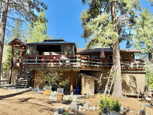 1900 Teton Way, Pine Mountain Club, CA 93222 - back of house featuring a wooden deck, stairs, a gazebo, and metal roof